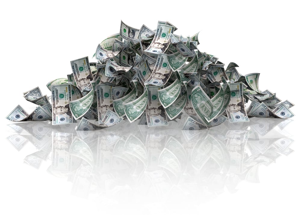 Pile of dollars - isolated over a white background